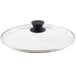 A Lodge glass lid with a black handle.