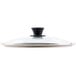 A Lodge tempered glass lid with a black handle.