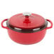 A Lodge Island Spice Red Enameled Cast Iron Dutch Oven with a lid.