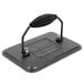 A Lodge black metal rectangular grill press with a hammered finish and a handle.