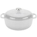 A white Lodge enameled cast iron dutch oven with a lid.