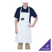A man wearing a white Chef Revival bib apron with a purple logo.