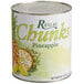 A case of Regal cans of pineapple chunks with a white label.