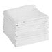 A stack of twelve white 100% cotton flour sack towels.