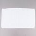 A white Chef Revival bar towel on a gray surface.