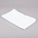 A white Chef Revival bar towel on a gray surface.