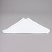 A folded white Chef Revival bar towel on a gray surface.