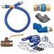 A blue Dormont gas connector kit with fittings and a restraining cable.