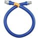 A blue Dormont stainless steel gas connector hose with a yellow label.