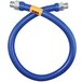 A blue Dormont stainless steel flexible gas connector hose with yellow labels on each end.