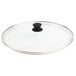 A clear glass lid with a black handle.