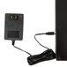 A black power supply with a cord attached to a rectangular object.