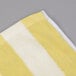 An Oxford yellow and white striped pool towel.