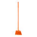 A close up of a Carlisle commercial broom with orange flagged bristles and a 48" handle.