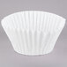 A white Grindmaster coffee filter on a white surface.