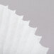 A close up of a white paper coffee filter.