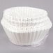 A white plastic bag filled with white paper coffee filters.