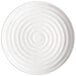A white GET Milano melamine plate with a spiral pattern on it.