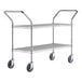 A silver metal Regency two-shelf utility cart with black wheels.