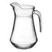 An Arcoroc clear glass pitcher with a handle.