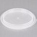 A clear plastic lid on a white circle.