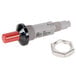 A red and black threaded nut with a red plastic cap and a button on a metal object.