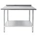 An Advance Tabco stainless steel work table with undershelf.