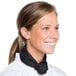 A smiling woman wearing a black Chef Revival neck scarf.