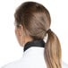 A woman wearing a black Chef Revival neckerchief with a ponytail.