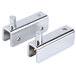 A pair of chrome steel door hinges.