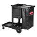 A black Rubbermaid janitor cart with a locking cabinet and attached waste bag.
