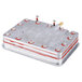 A metal box with red and silver wires.