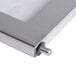 A close up of a stainless steel frame for a Nemco popcorn popper.