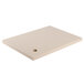 A white rectangular polyethylene carving board with a hole in the middle.