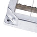 A Nemco blade and holder assembly for a lettuce cutter with a metal piece with holes in it.