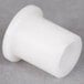 A white plastic bushing for a Nemco chicken slicer.