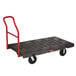 A black Rubbermaid heavy-duty platform truck with a red handle.