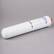 A white cylinder with a blue label and a red cap for Bunn water filtration systems.