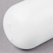 A white oval Bunn replacement cartridge with a white label.