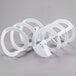 A white plastic Bunn hopper set with circles.