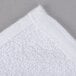 An Oxford Gold white bath towel with a cam border.