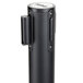 A black metal Aarco crowd control stanchion pole.