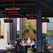 A Bromic Heating natural gas patio heater on a table in a outdoor patio.