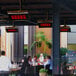 A Bromic Heating Platinum Smart-Heat propane patio heater on an outdoor restaurant patio.