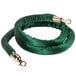 A green velvet rope with brass ends.