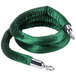 A green velvet rope with silver metal ends.