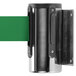A metal cylinder with a green ribbon.