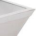 A white square stainless steel bowl with a square white metal sink.