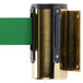 A brass wall-mount stanchion with a green retractable belt attached.
