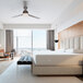 A white bed with a Bargoose Hybrid Zippered bed bug proof mattress cover.